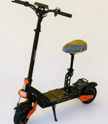 SF-16D Kumax electric scooter with seat, black and orange design, front light, suspension system, and wide deck for comfortable urban riding.
