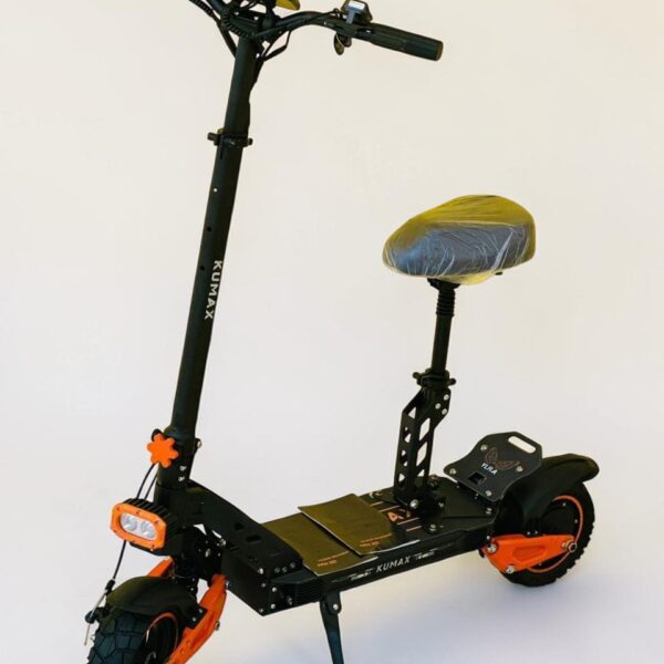 SF-16D Kumax electric scooter with seat, black and orange design, front light, suspension system, and wide deck for comfortable urban riding.